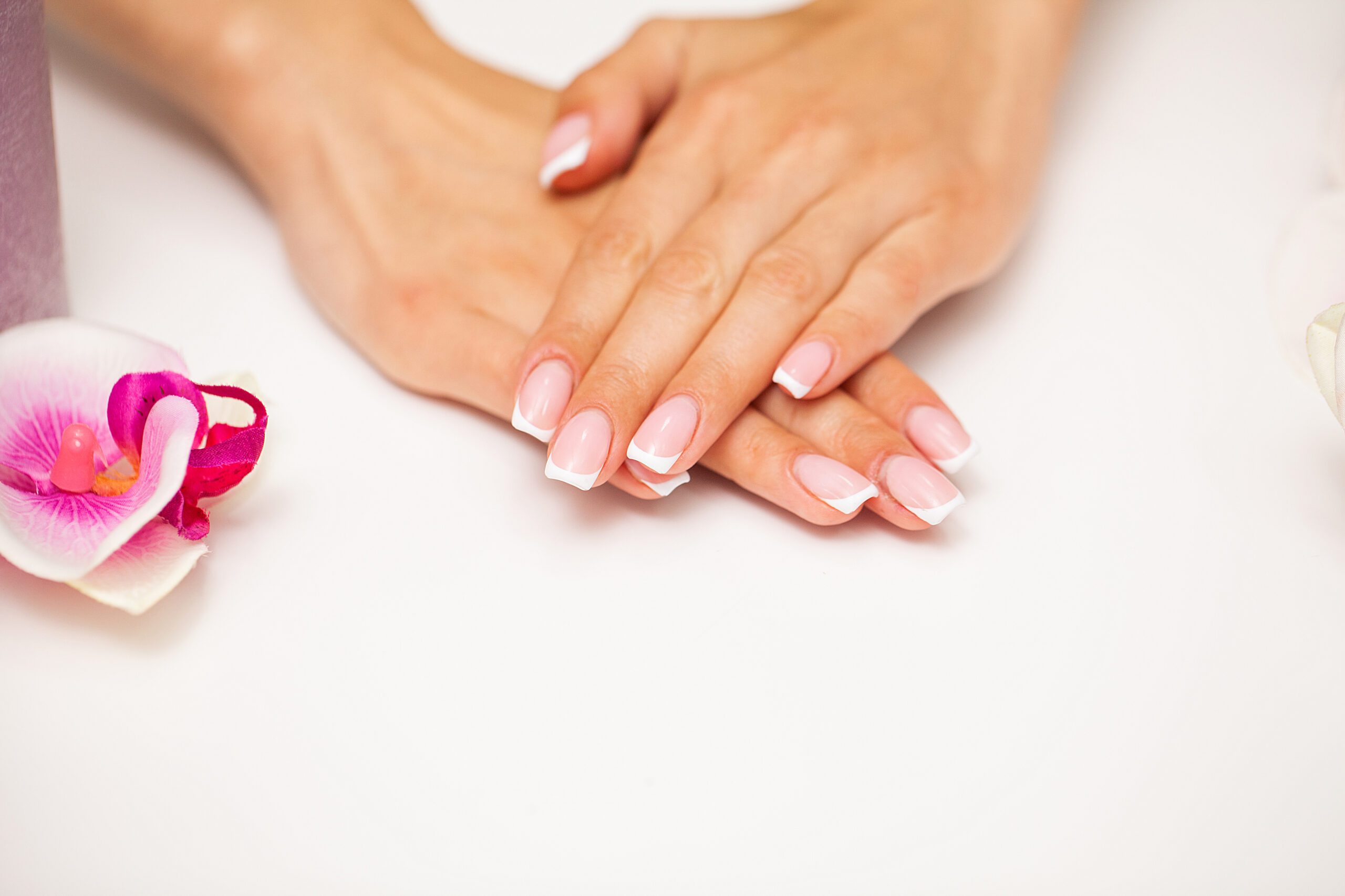 Young woman after getting professional manicure in beauty salon.